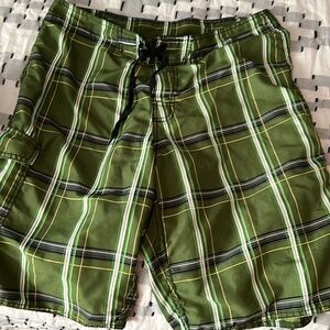 Knee length board shorts.